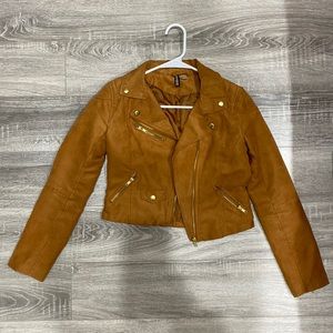 Faux brown leather jacket with zippers on sleeves.